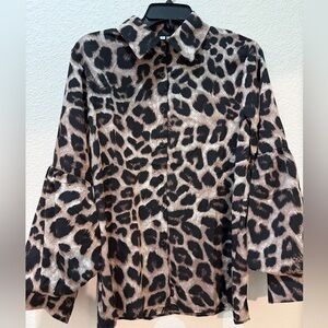 Women’s leopard button-down blouse with fancy puffy arms, size medium